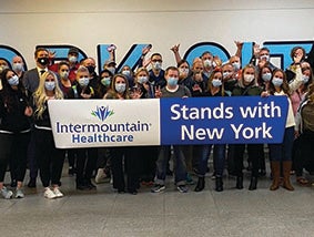 Intermountain Healthcare, Holding a sign - Stand with New York